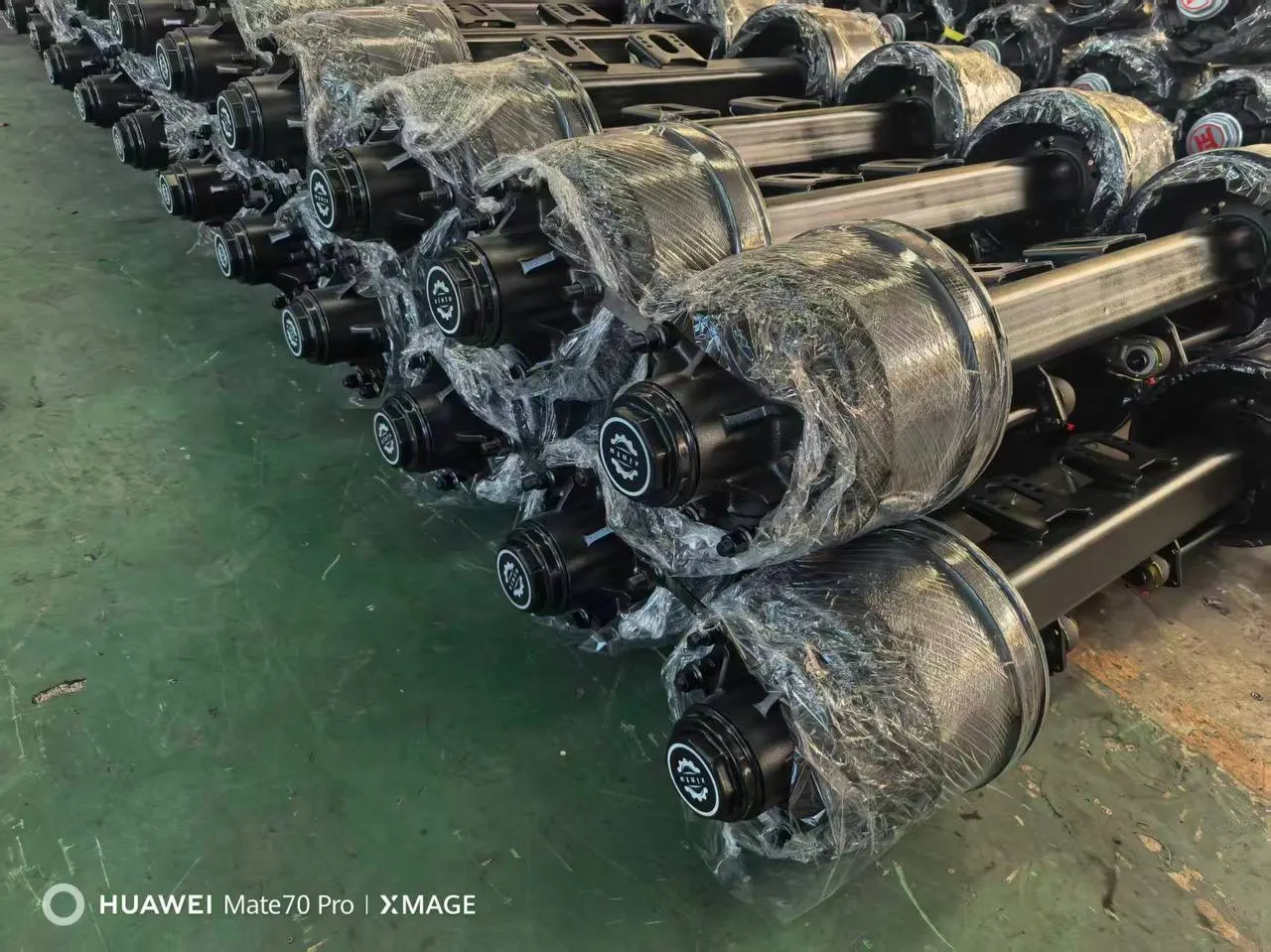 Trailer axles and suspension assemblies